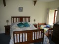 garden view bedroom with toddler bed